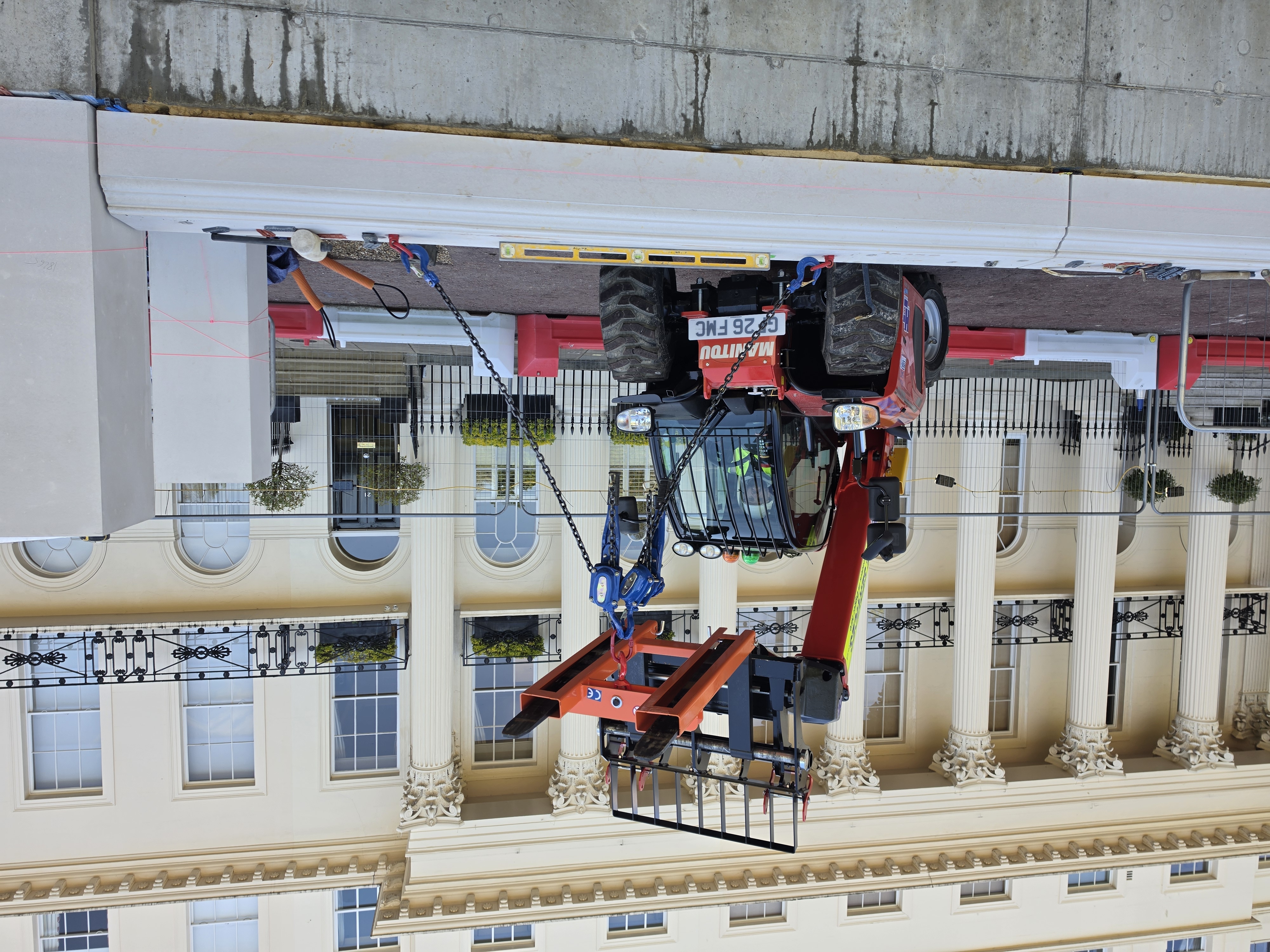 A17E telehandler driver handling 1.2t stone block at Chester Terrace London